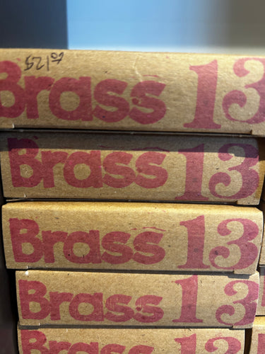The Gabriel Tenorio String Company Brass 12/13 acoustic guitar strings.
